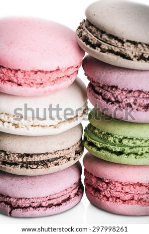 Colorful macaroon cake in a row isolated not a white background. focus on the bottom portion of the frame