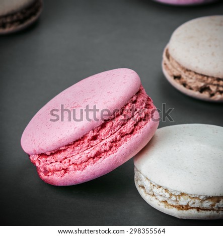 Sweet and colourful french macaroons. focus on the foreground macaroons