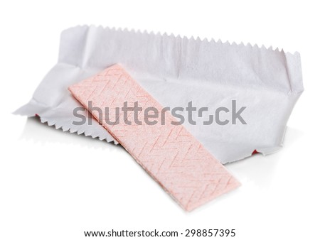 chewing gum is on the white background with paper. focus in the middle of the chewing gum