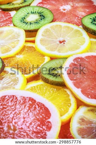 background with citrus-fruit of Fresh fruit slices. focus in the center of the frame. Shallow depth of field