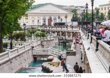Moscow, Russia - May 23, 2015: tourists in the Alexander Garden fountains. Alexandrovsky Garden Park in the center of Moscow was founded in 1812 on the site of the river Neglinnaya