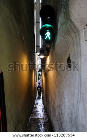 One narrow alley has a novel solution to pedestrian traffic