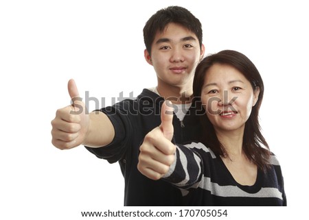 Asian mom and son showing thumb up on a white background