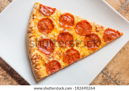 Closeup view of a slice of a pepperoni pizza