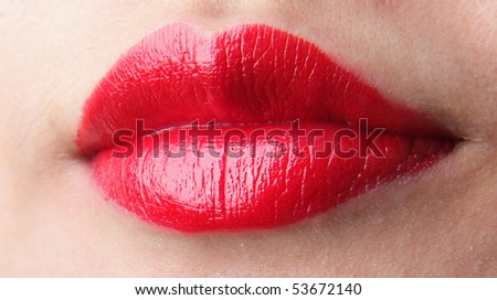Female lips with red lip gloss