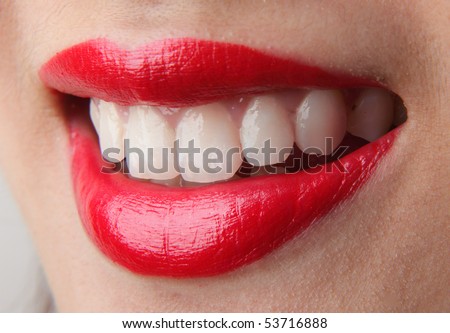 Female lips with red lip gloss