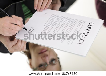 business woman signing contract; business concepts and ideas