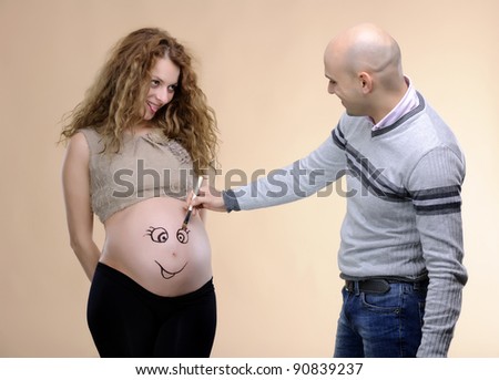 pregnancy concept family studio shot ; love and parenthood