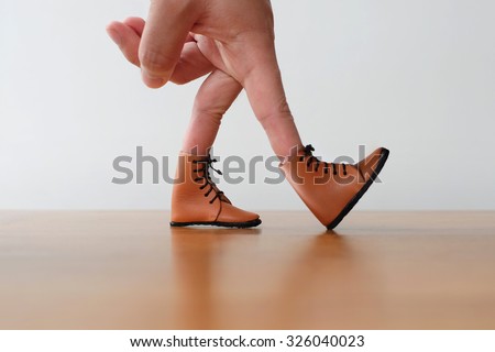 hand finger walking with shoe concept