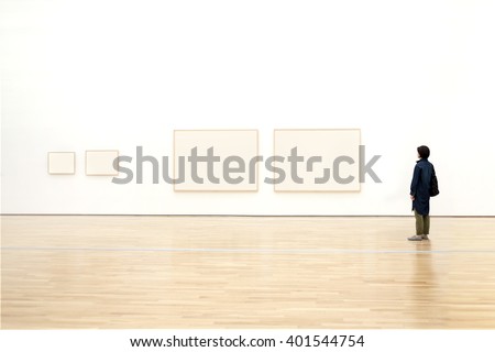 woman watching blank photo frame on wall art gallery, art exhibition