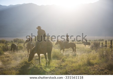 Sedona. Arisona USA - September 16, 2014: Group of cowboys on horseback in Pine Valley at sunrise. Sedona. Arisona
