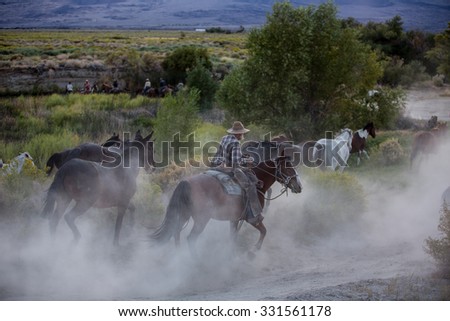 Sedona. Arisona USA - September 16, 2014: Group of cowboys on horseback in Pine Valley at sunrise. Sedona. Arisona