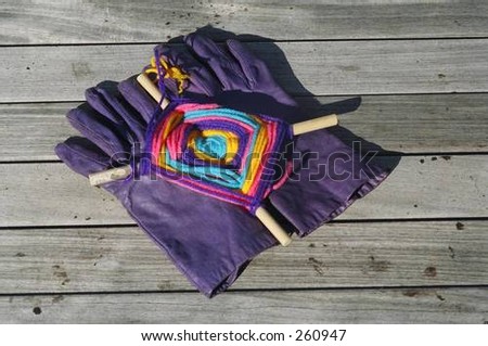 Colorful Object on Purple Gloves on Pier