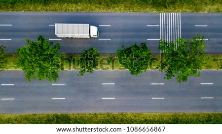 The top view of transport truck in the main road.