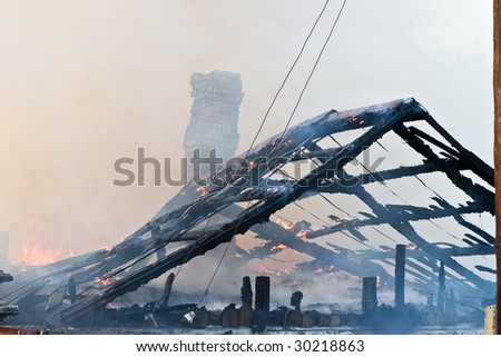 Wooden house on the huge fire