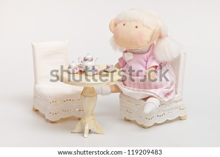 handmade toy cute litlle girl having a tea