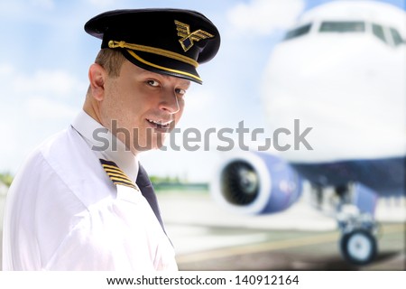 Smiling pilot goes into the plane
