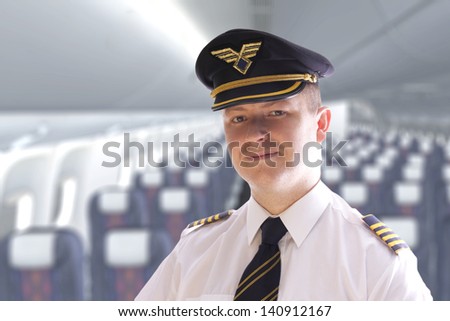The pilot in the cabin waiting for passengers