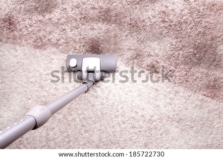 vacuuming dirty carpet