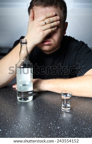Alcohol problem - helpless man drinking vodka