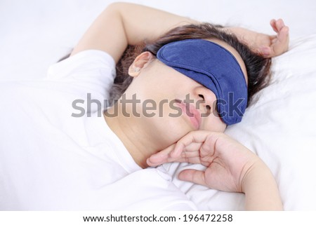 Sleeping lady with a blindfold.