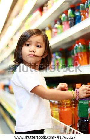 stock photo young asian girl shopping at the grocery