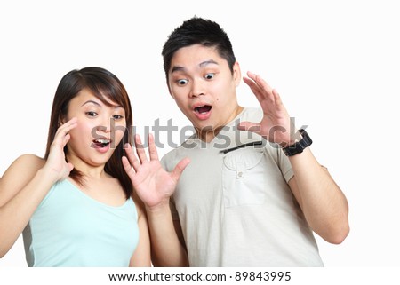 Couple showing surprised or amazed expression.