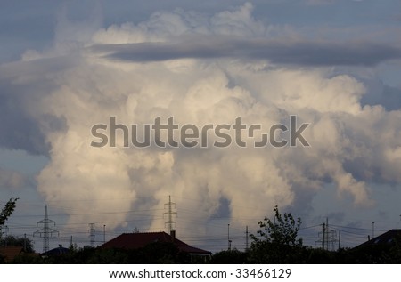Dark cloud above city, ecology