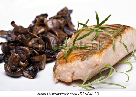 Grilled fish, salmon steak with mushrooms