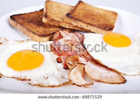 Breakfast - roasted toasts, eggs, bacon