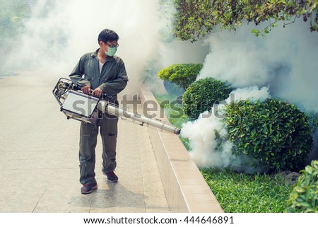 The man fogging to eliminate mosquito for prevent spread dengue fever