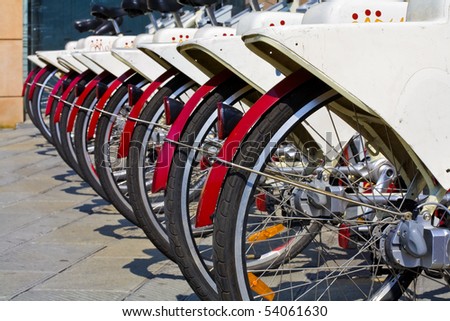a row of bikes for rent for an eco friendly tourism in genoa, italy