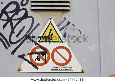 a danger sign and urban graffiti