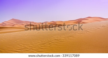 Constrat of the Saara dunes and the sky after a sand storm.