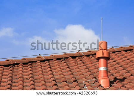 Output air tube on a roof with lightning conductor