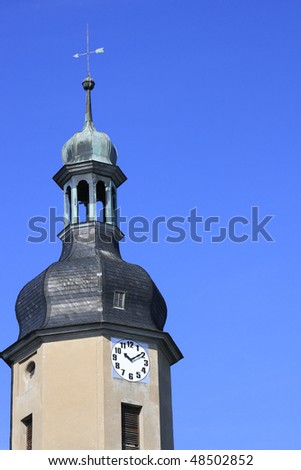 Church clock shows ten minutes after ten