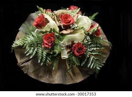 A large bouquet of red roses isolated on black
