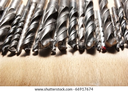 Drill Bits over wooden work board
