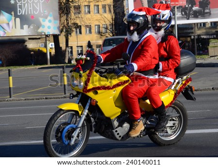 BELGRADE, SERBIA - DECEMBER 27:  Undefined Santas delivering humanitarian aid in form of gifts to disabled children during annual Santa Claus Motorcycle Parade on 27 December 2014 in Belgrade, Serbia