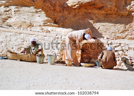 VALLEY OF THE KINGS, EGYPT- NOV 22:Unidentified men work for excavation of tombs and buried treasure on November 22, 2009, Valley of the Kings, Egypt, often called the Valley of the Gates of the Kings