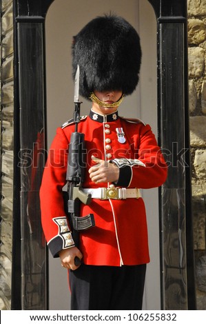 LONDON - ENGLAND JUNE 02:Queen\'s Guard - Tower of London on June 02 2012. The Queen\'s Guard is the contingents of infantry and cavalry soldiers charged with guarding the official royal residences.