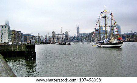 LONDON, UK-JUNE 1: Boats decorated with flags and bunting for the Queen's Diamond Jubilee celebrations, with the Tower Bridge in background. June 1, 2012 in London UK