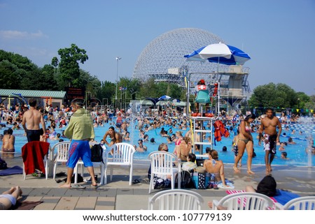 MONTREAL CANADA JULY 15: Parc Jean-Drapeau pool with the biosphere in background on July 15 2012 in Montreal Canada. The pool was the site of the 2006 world FINA aquatic championship in Montreal