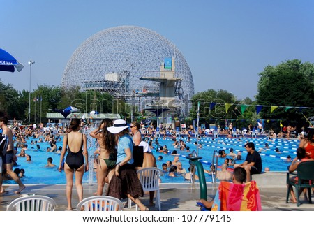 MONTREAL CANADA JULY 15: Parc Jean-Drapeau pool with the biosphere in background on July 15 2012 in Montreal Canada. The pool was the site of the 2006 world FINA aquatic championship in Montreal