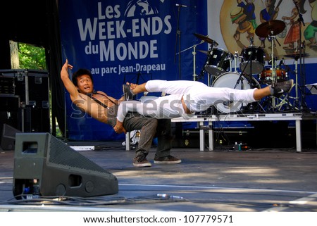 MONTREAL CANADA JULY 15: Cambodian acrobats in action a the Montreal\'s Week-ends du monde presented at Parc Jean-Drapeau. On july 15 2012 in Montreal Canada