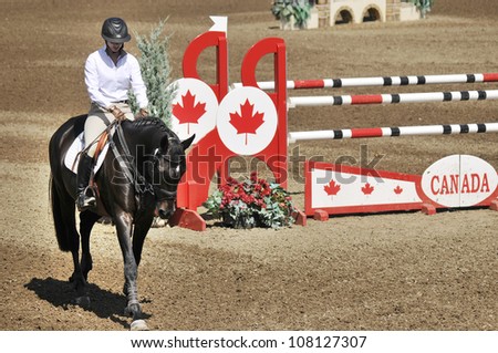 BROMONT-CANADA JULY 20: Unknown rider on a horse during 2012, INTERNATIONAL BROMONT on July 20, 2012 At the Equestrian 1976 Montreal Olympic Park.