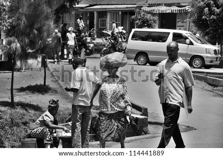 ARUSHA, TANZANIA - NOVEMBER 25: Native people made affairs near main road on November 25, 2011 in Arusha, Tanzania. Arusha is a city in northern Tanzania. It is the capital of the Arusha Region.