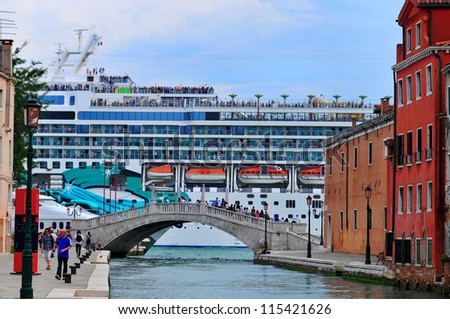 VENICE - JUNE 12: Cruise ship crossing Grand canal on June 12, 2011 in Venice, Italy. More than 20 million tourists come to Venice annually.