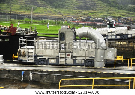 GATUN LOCKS - PANAMA CANAL-NOV. 7: Trains (mules) side Panama Canal.  These mules are used for side-to-side and braking control in the rather narrow locks On nov. 7 2012 in Panama.
