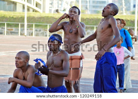 CAPE TOWN - SOUTH AFRICA - MAY 25 : Unidentified young men wears workers clothing, during presentation of soweto street dancing, south african style  on May 25, Cape Town, South Africa.